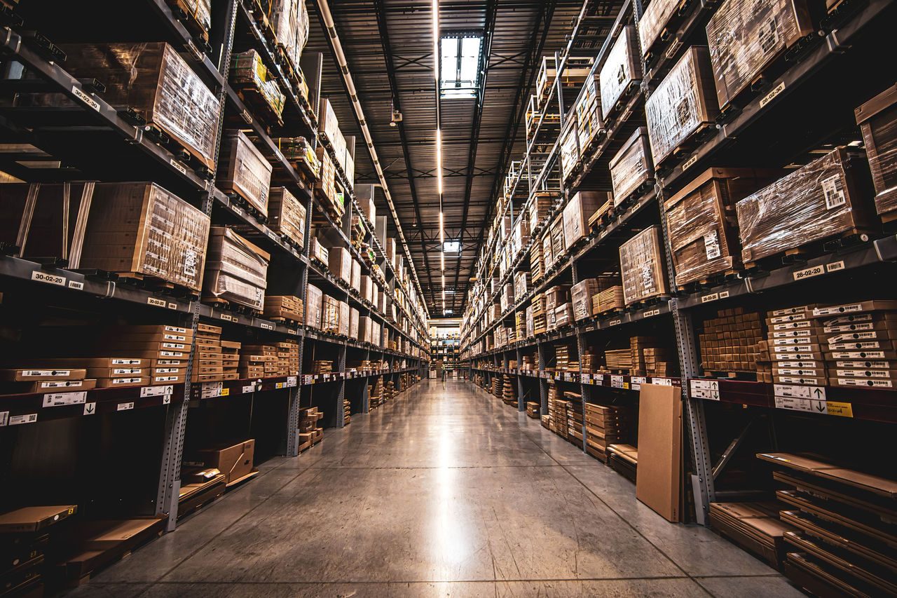 Wide angle view of organized warehouse storage aisles