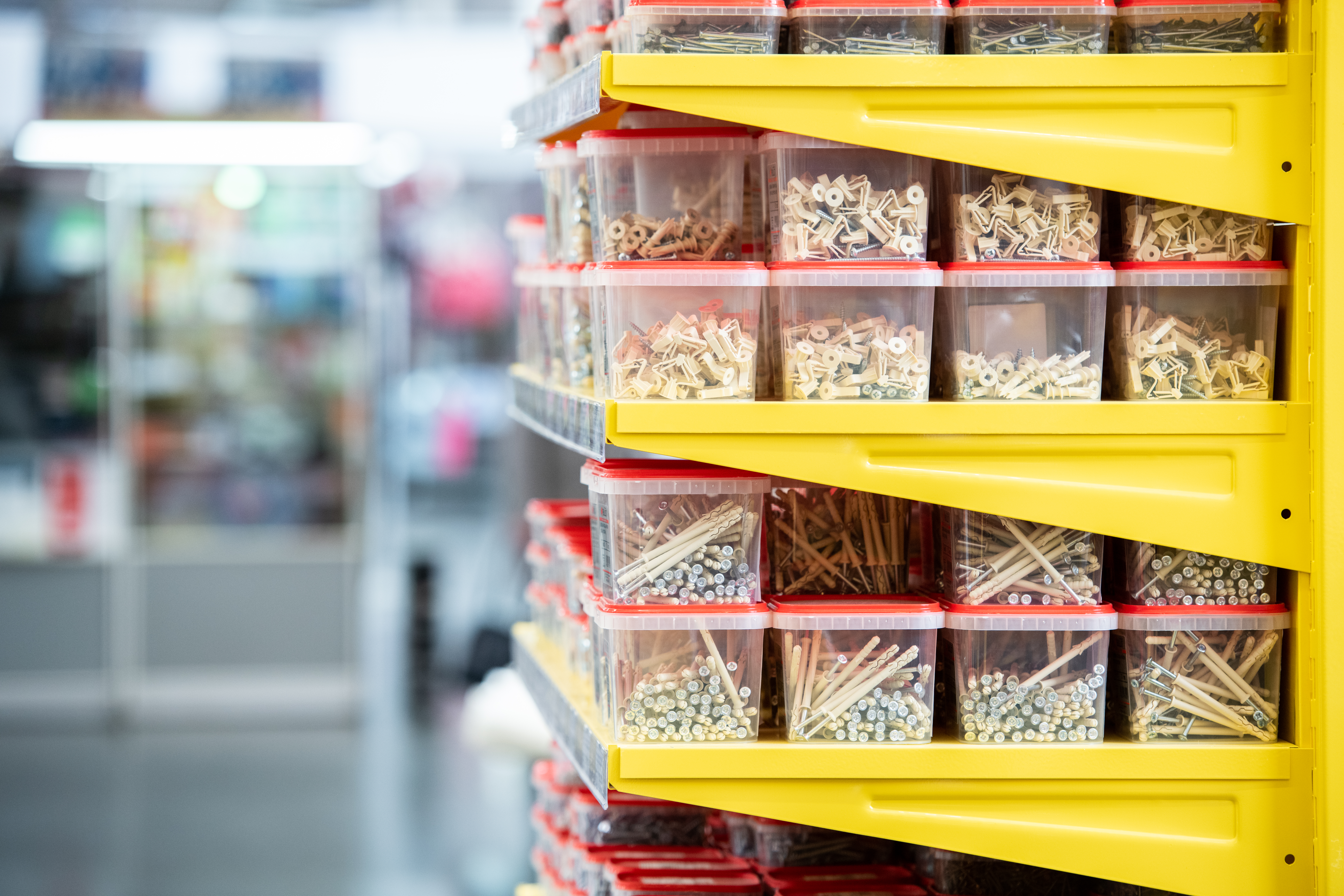 Organized hardware screws and bolts in plastic bins