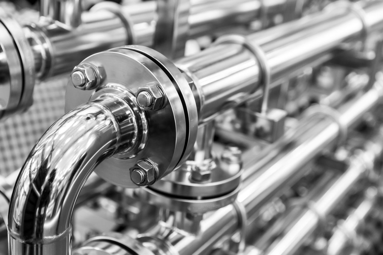 Close-up of industrial stainless steel piping system