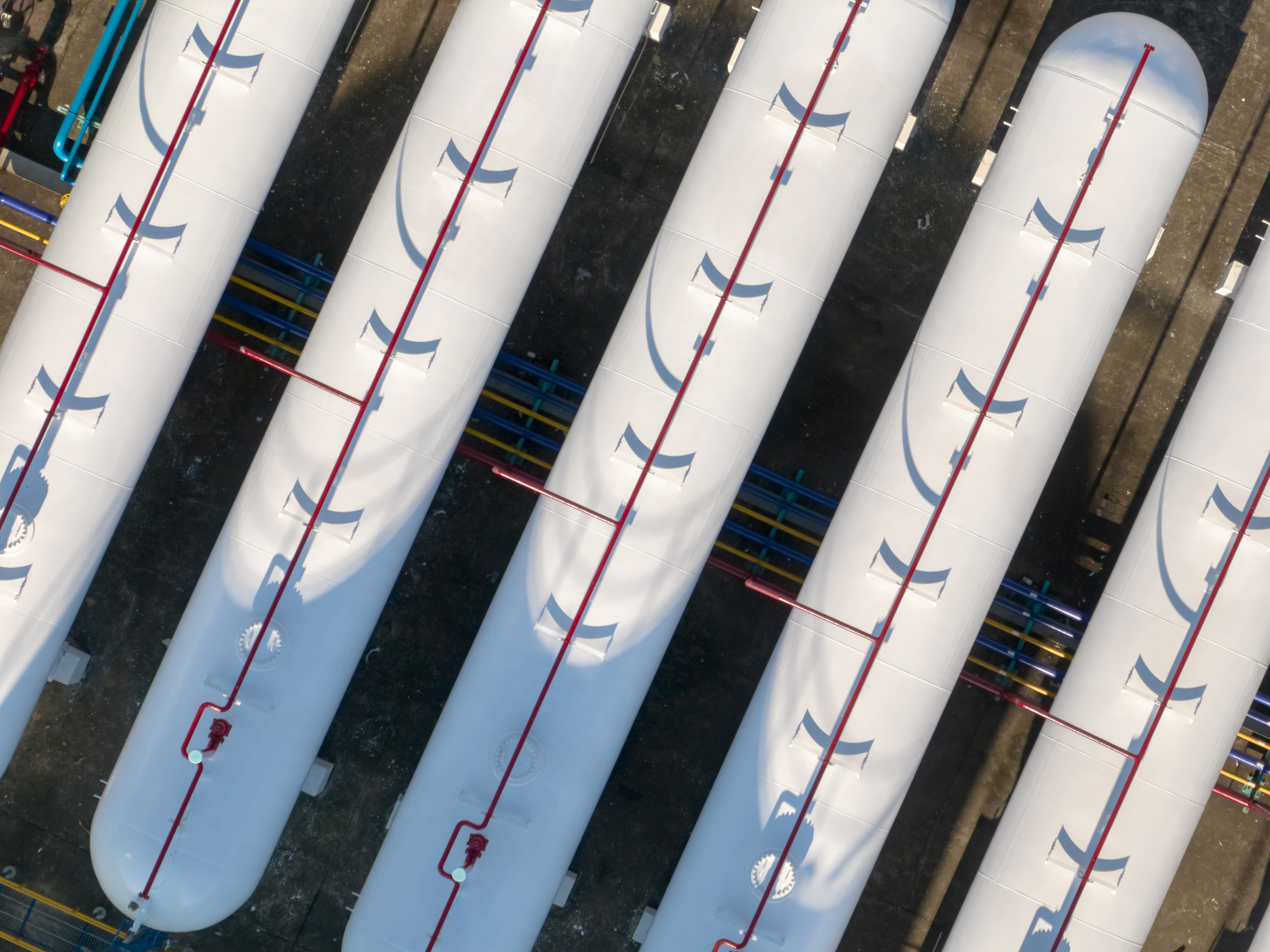 Aerial view of industrial storage tanks and pipelines