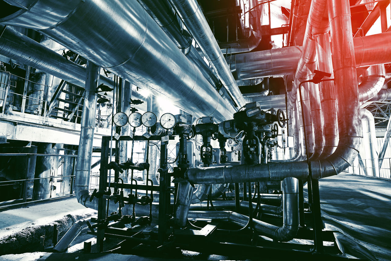 industrial facility with metal pipes and gauges
