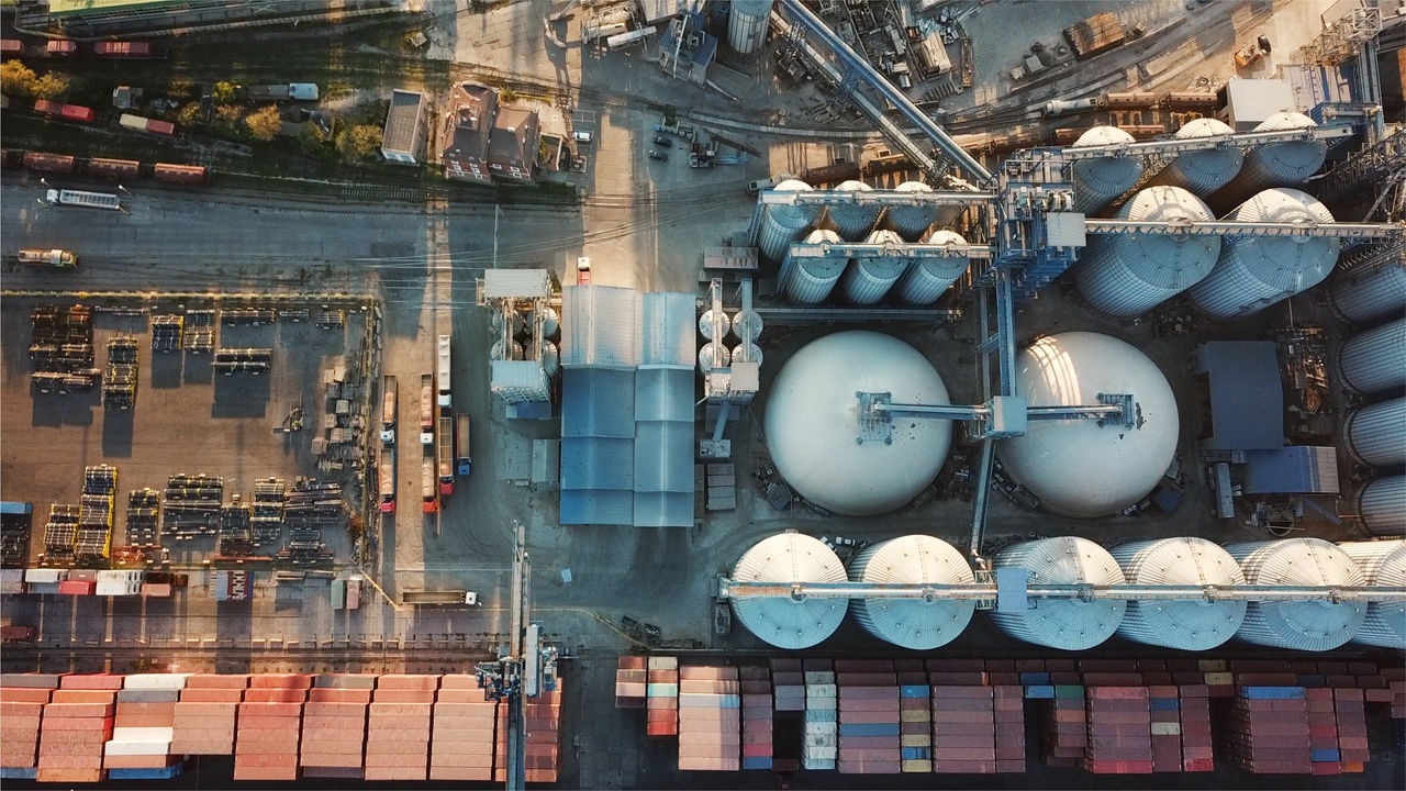 Aerial view of industrial facility with storage tanks