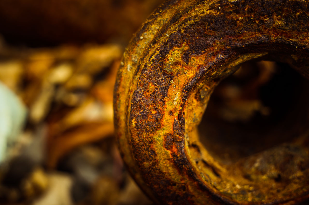 Close-up of heavily rusted metal object outdoors